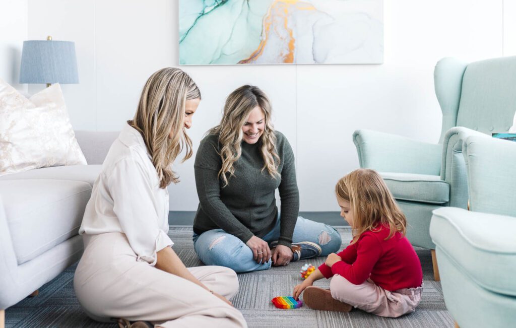 Counsellor in Kanata engaging in play therapy with a child and mom